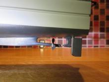 Detail zapouzdřené hřídele, zvětšeného kormidla a ponechaného zbytečného kozlíku